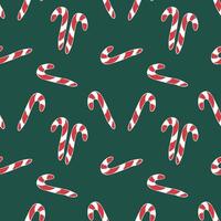 Christmas and New Year pattern in handmade style. Seamless texture of Christmas candy on a dark green background.Candy cane. vector
