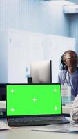 Vertical Senior medic consulting ill man in cabinet with isolated mockup screen, checking the hospital records to do another x ray scan interpretation. Old patient discuss with his physician. Camera A. video