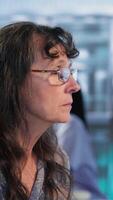 Vertical Doctor provides cancer screening guidance to a patient in office, discussing MRI scans and tumor growth. Early detection and preventative medicine are emphasized for better health outcomes. Camera B. video