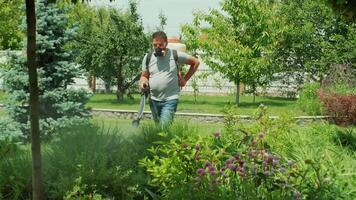 Spray ecological pesticide. Farmer fumigate in protective mask and glasses trees and bushes. video