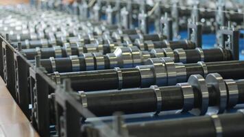 Automated roll forming machine with synchronized roller mechanisms. video