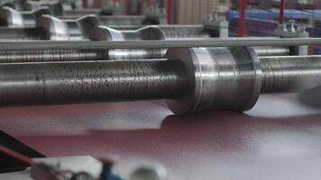 Metal forming line rollers processing sheets with precise symmetrical movement. video