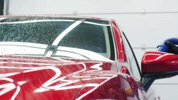 Water droplets on car after thorough wash and drying process. video