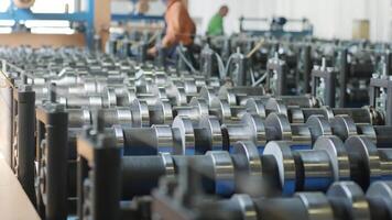 Production line with multiple rollers used in metal forming process. video