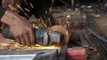 close up of man's hand grinding without using safety gloves. unsafe grinding work video