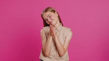 Woman showing a little bit gesture with sceptic smile showing minimum sign measuring small size video