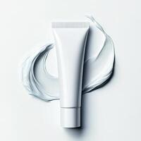 Realistic image of face cream tube with smooth spread on white. photo
