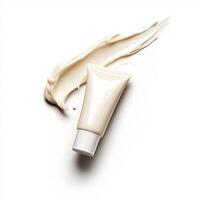 Fresh face cream from tube, gently spreading on white background. photo