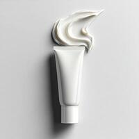Creamy texture of face cream on white, tube in focus. photo