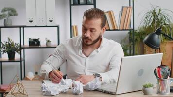 Angry furious man working at home office throwing crumpled paper, having nervous breakdown at work video