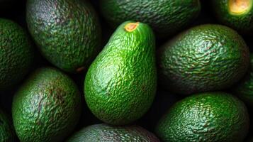 Fresh Green Ripe Avocados in a Close up View Showcasing Their Rich Texture and Color photo