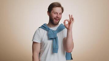 Happy man looking approvingly, showing ok approve feedback gesture like sign positive something good video