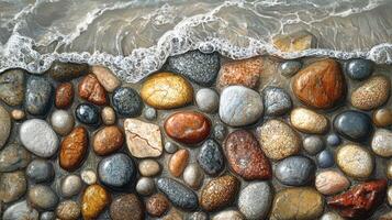 Colorful Wet Pebbles Glisten Along the Shoreline, Reflecting the Gentle Ocean Waves During Sunrise photo