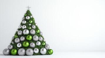 Creative Christmas Tree Design Featuring Green and Silver Ornaments on a Bright White Background photo