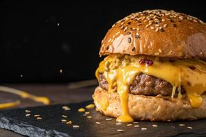 Close-up of melted cheese in burger front view on black background, HDR image photo