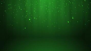 Green glowing circles particles falling in the air and light rays at the top middle of a cyc wall background, horizontal composition. Loop animation footage for graphic design. video