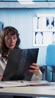 Vertical Medic gives a bad concerning diagnosis to elderly patient at checkup, offering support and advice to try a recovery plan. Dangerous health problems for a senior man. Camera A. video