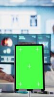 Vertical Old general practitioner consulting a female patient next to chroma key space, discussing about important medicine. Physician offers professional advice and suggestions for treatment. Camera A. video