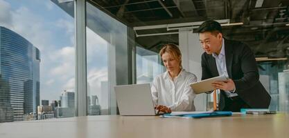 Engaging in a Collaborative Business Meeting within a Modern Office Environment Setting photo