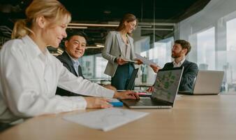 A Diverse Team Effectively Collaborating in a Modern and Dynamic Office Environment photo