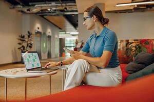 A Business Professional is Working Remotely in a Modern Office Space with Great Vibes photo