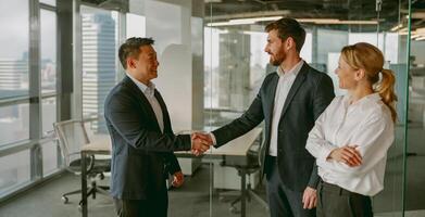A Professional Business Meeting with a Firm Handshake in a Modern Office Environment Setting photo