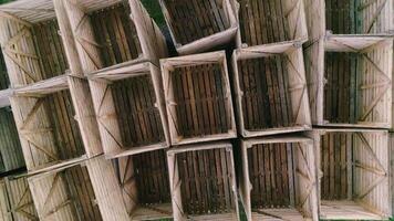Top-down view of empty stacked wooden crates for harvest packaging. video