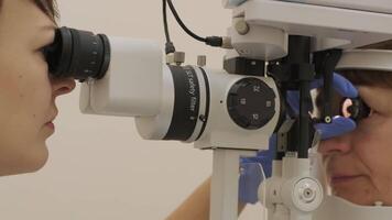 Laser ophthalmology exam using slit lamp and digital controls. video