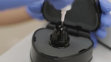 Ophthalmologist surgeon apply the gel to the surface Ophthalmoscopy Lens which is used in ophthalmic for the general diagnosis of eye diseases and specifically for Selective Laser Trabeculoplasty 2 video