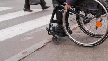 A person with a disability moves along the street in a wheelchair, the border prevents the movement of the wheelchair 2 video