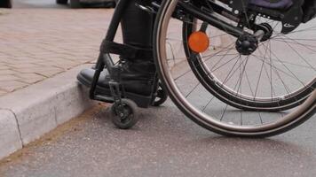 A person with a disability moves along the street in a wheelchair, the border prevents the movement of the wheelchair 5 video