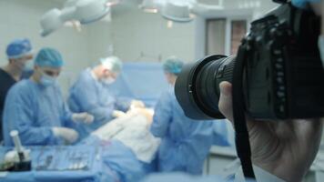 Breast augmentation under the guidance surgeons team in surgical operating room, blurred background video