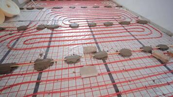 Installing underfloor heating pipes for water heating. Heating systems. Pipes for a heat-insulated floor. 38 video