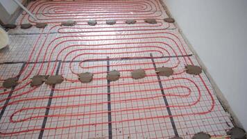 Installing underfloor heating pipes for water heating. Heating systems. Pipes for a heat-insulated floor. 6 video
