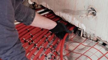 Installing underfloor heating pipes for water heating. Heating systems. Pipes for a heat-insulated floor. 16 video