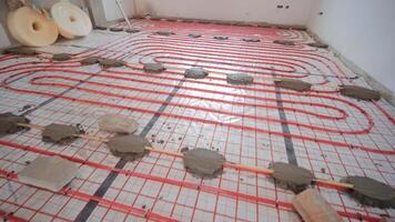 Installing underfloor heating pipes for water heating. Heating systems. Pipes for a heat-insulated floor. 3 video