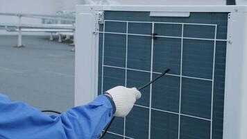 The technician uses a digital camera to check the clogging of the heat exchanger 15 video