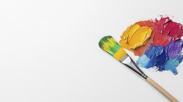 Colorful Paint Palette With Paintbrush On White Background photo