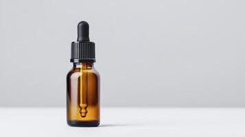 Amber Glass Dropper Bottle On White Background photo