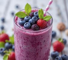 Purple Berry Smoothie with Fresh Fruit Garnish photo