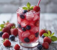 Iced Berry Drink with Strawberries and Blueberries photo