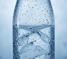 Close Up Of Water Bottle With Ice And Condensation photo
