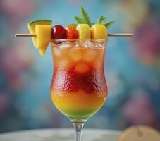 Layered Tropical Fruit Cocktail with Colorful Background photo