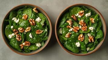 Fresh Spinach Salad With Walnuts and Feta Served in Wooden Bowls for a Healthy Meal photo