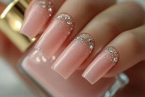 Elegant Nail Design With Glitter and Rhinestones in Soft Pink Tones photo