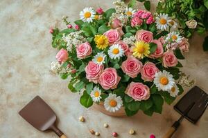 Beautiful Pink Roses and Daisies Arranged in a Basket on a Gardening Workspace During Springtime photo