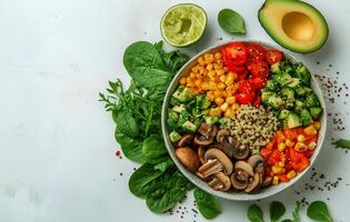 Colorful Salad Bowl Filled With Fresh Vegetables and Quinoa on a Light Surface photo