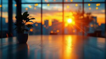 Sunset View From a Cozy Indoor Space With a Plant on the Table and City Skyline in the Background photo