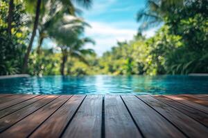 Serene Poolside View With Lush Greenery and Clear Blue Water in a Tropical Setting photo