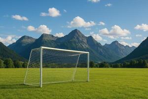 Scenic Mountain Landscape Featuring a Soccer Goal on a Vibrant Green Field photo